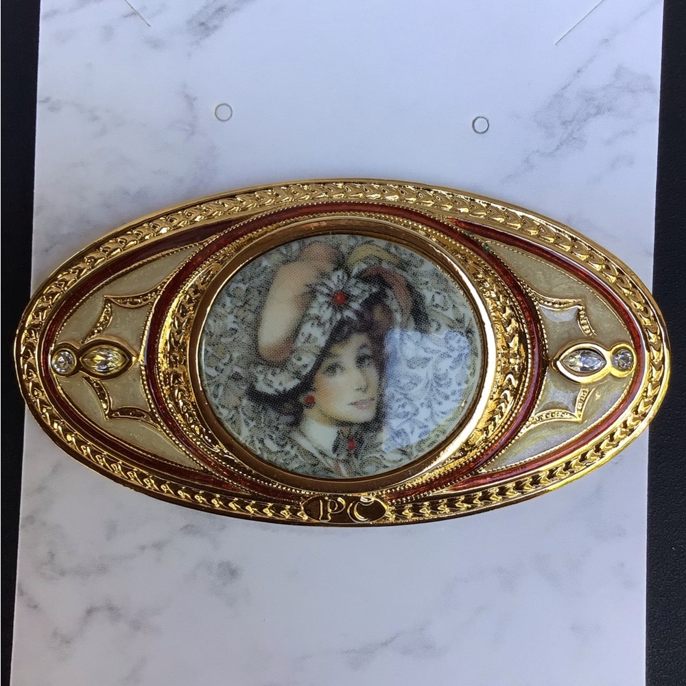 Elegant Gold and Red Brooch
